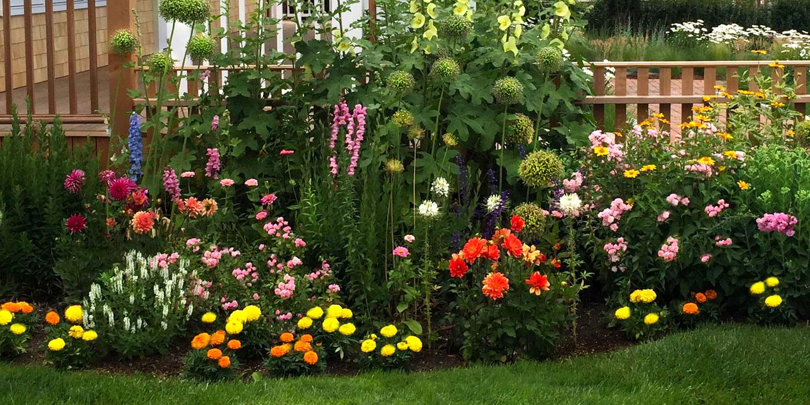 Colorful layered planting around a home.